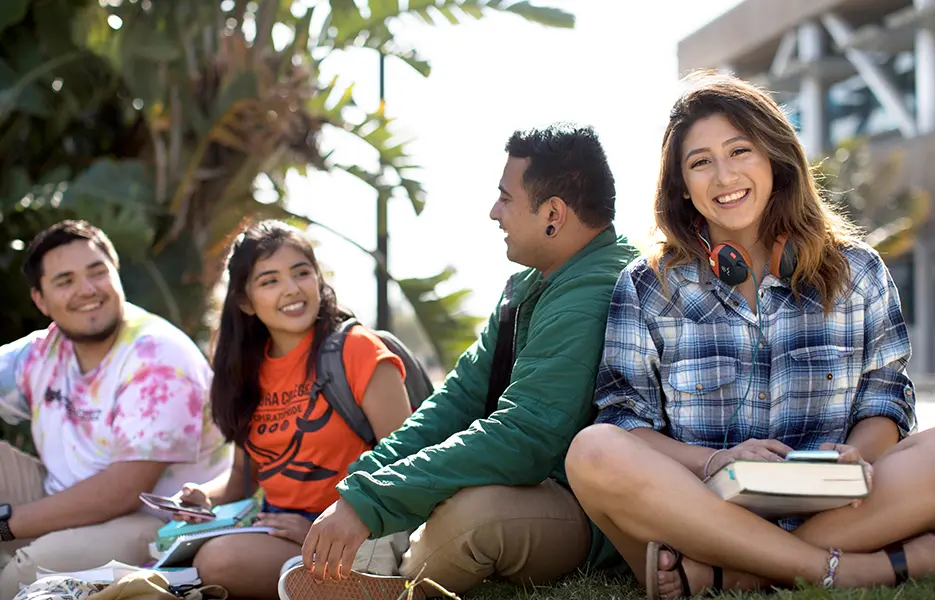 Students sitting in grass