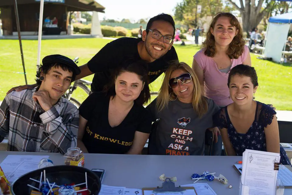 VC Students Sitting at a booth