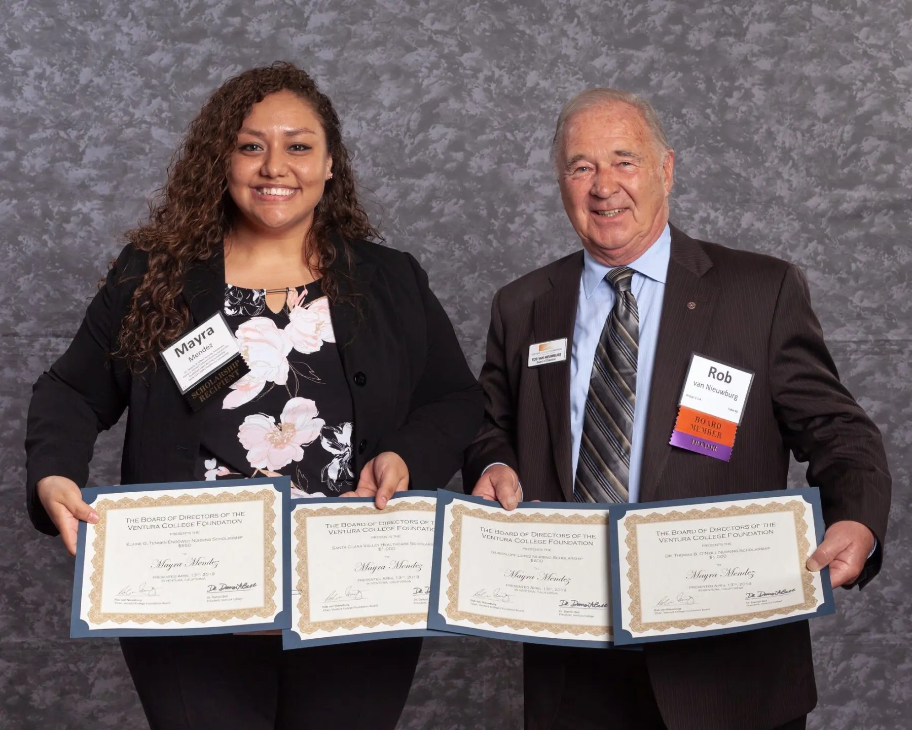 Rob and Mayra Holding Awards