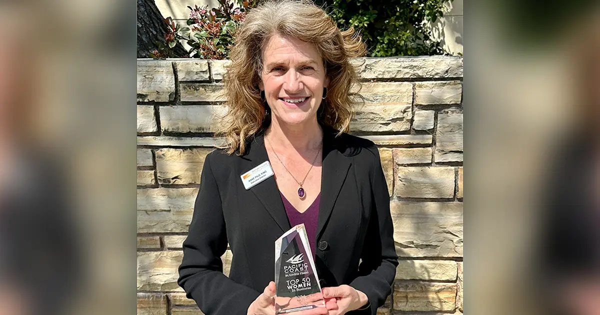 Anne standing with her award