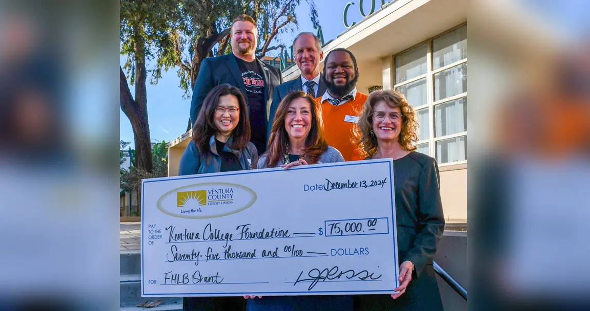 A group of six people smiling and holding a large check for $75,000 from Ventura County, dated December 12